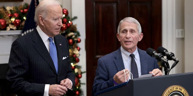 Anthony Fauci (R), director of the National Institute of Allergy and Infectious Diseases and chief medical adviser to the president, speaks alongside U.S. President Biden as he delivers remarks on the Omicron COVID-19 variant following a meeting of the COVID-19 response team at the White House on Nov. 29, 2021 in Washington, D.C. (Photo by Anna Moneymaker/Getty Images)