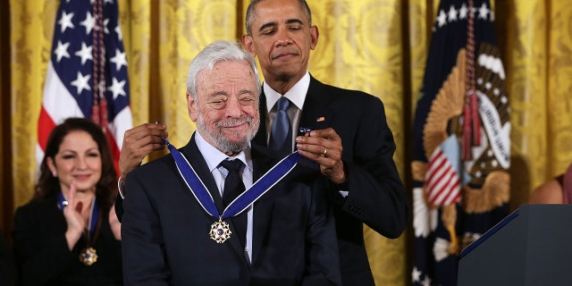 U.S. President Barack Obama presents the Presidential Medal of Freedom to theater composer and lyricist Stephen Sondheim during an East Room ceremony November 24, 2015 at the White House in Washington, DC.