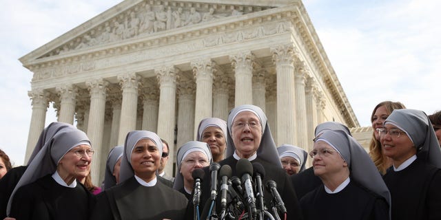 Mother Loraine Marie Maguire (center) of the Little Sisters of the Poor speaks to the media after arguments at the U.S. Supreme Court, March 23, 2016, in Washington, D.C. (Photo by Mark Wilson/Getty Images)