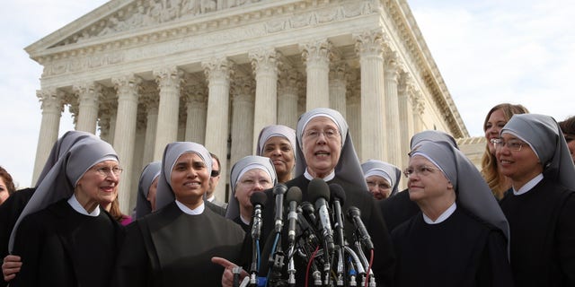 Mother Loraine Marie Maguire (center) of the Little Sisters of the Poor speaks to the media after arguments at the U.S. Supreme Court, March 23, 2016, in Washington, D.C. (Photo by Mark Wilson/Getty Images)