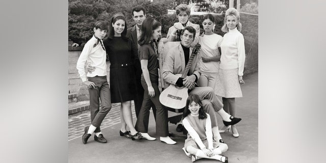 Entertainer Dean Martin (1917-1995) with his wife Jeanne (1927-2016) and children (Gail, Craig, Claudia, Deana, Gina, Ricci and Dean Paul) pose for a family portrait in 1966 in Los Angeles, California.