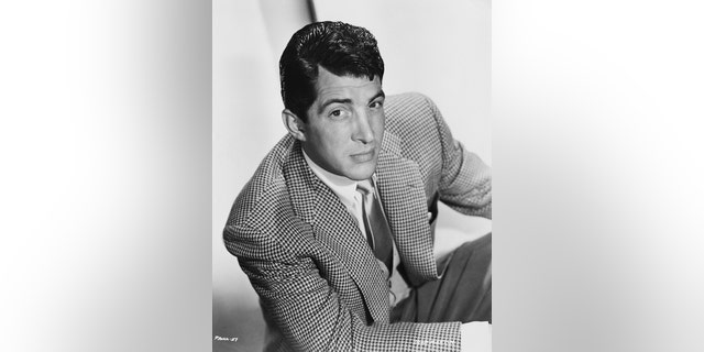 Dean Martin posing in a black and white photo
