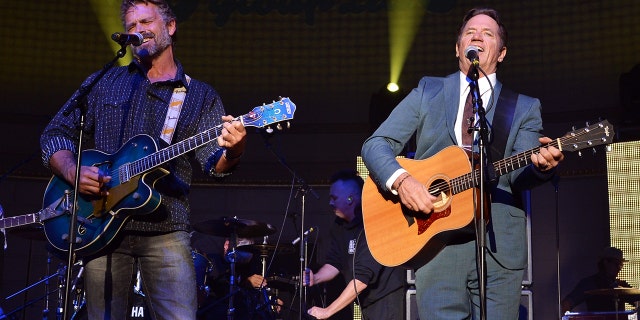 John Schneider and Tom Wopat perform onstage during the Agency Group Party at at IEBA Conference Day 3 at the War Memorial Auditorium on October 9, 2012, in Nashville, Tennessee.