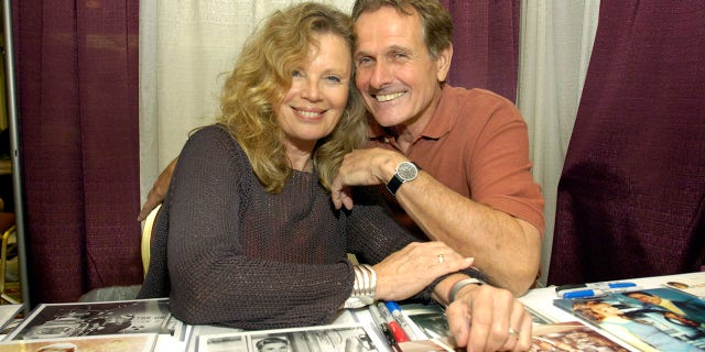 Marta Kristen and Mark Goddard.