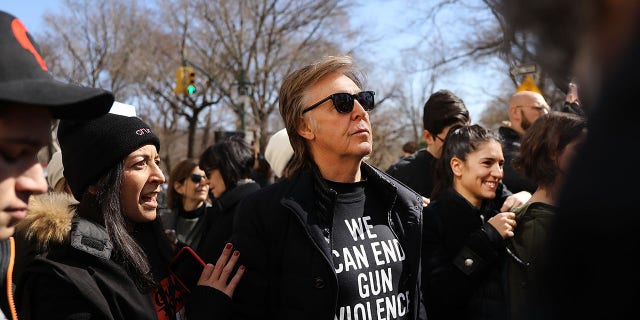 Sir Paul McCartney marched against gun violence in Manhattan during the March for Our Lives rally on March 24, 2018 in New York. John Lennon was entering his luxury Manhattan apartment when he was shot at close range with a .38-caliber revolver.