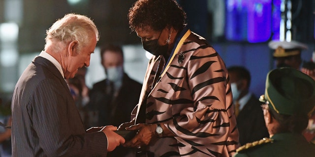 President of Barbados, Dame Sandra Mason awards Prince Charles, Prince of Wales with the Order of Freedom of Barbados during the Presidential Inauguration Ceremony at Heroes Square on November 30, 2021 in Bridgetown, Barbados.