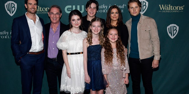 Cast members from left to right: Ben Lawson, Richard Thomas, Marcelle LeBlanc, Christian Finlayson, Tatum Matthews, Callaway Corrick, Bellamy Young and Logan Shroyer pose during the screening and reception celebrating ''The Waltons' Homecoming'' at The Garland on November 13, 2021 in North Hollywood, California.
