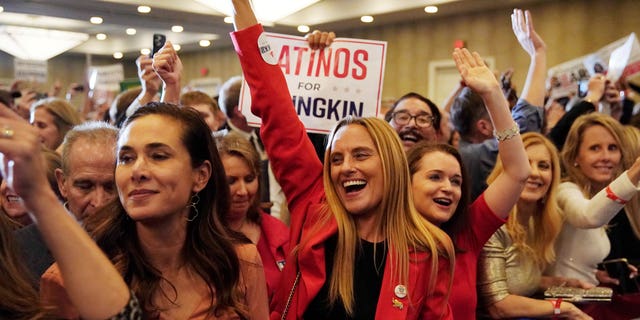 Supporters of Republican nominee for Governor of Virginia Glenn Youngkin react as Fox News declares Youngkin has won his race against Democratic Governor Terry McAuliffe and Youngkin will be the next Governor of Virginia during an election night party at a hotel in Chantilly, Virginia, U.S., November 3, 2021. REUTERS/ Elizabeth Frantz?