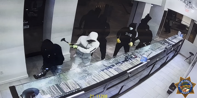 A suspect uses a hammer during a robbery at a jewelry store in California.