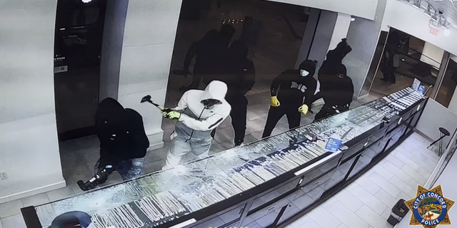 A suspect uses a hammer during a robbery at a jewelry store in California.