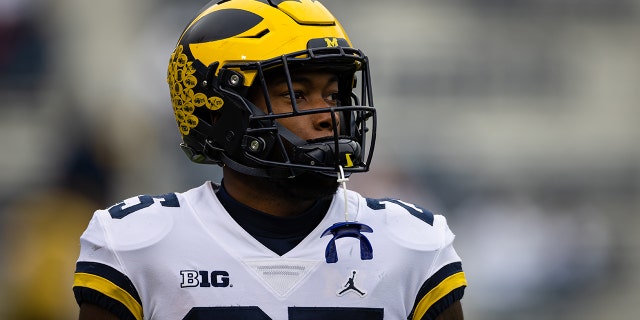 Hassan Haskins of the Michigan Wolverines warms up before the game against the Penn State Nittany Lions at Beaver Stadium on Nov. 13, 2021, in State College, Pennsylvania.