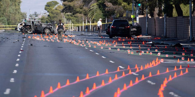 Las Vegas Metro Police investigators work at the scene of a fatal crash Tuesday, Nov. 2, 2021, in Las Vegas. 