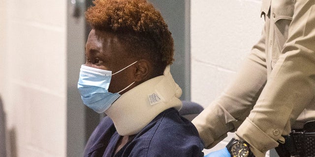 Former Raiders wide receiver Henry Ruggs, accused of DUI resulting in death, is brought into a courtroom during his initial arraignment at the Regional Justice Center, on Wednesday, Nov. 3, 2021, in Las Vegas. Ruggs was involved in the fiery crash early Tuesday that left one person dead.