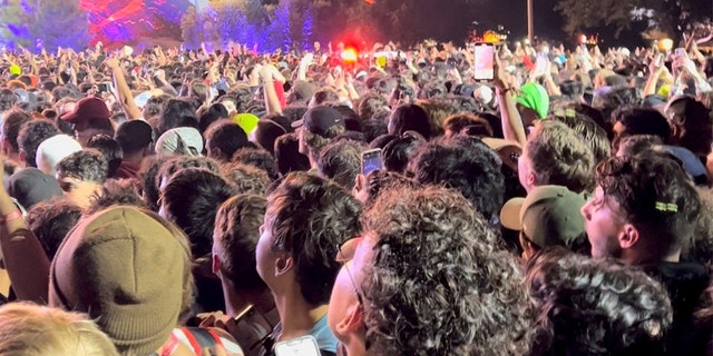 Ambulance lights are seen in the crowd during the Astroworld music festiwal in Houston, November 5, 2021 in this still image obtained from a social media video on November 6, 2021.