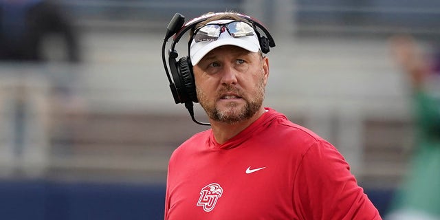 Liberty head coach Hugh Freeze looks toward his team during the second half of a game against Mississippi in Oxford, Miss., Nov. 6, 2021.