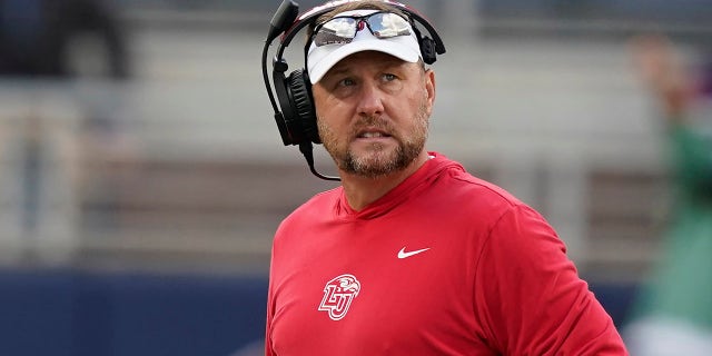 Liberty head coach Hugh Freeze looks toward his team during the second half of a game against Mississippi in Oxford, Miss., Nov. 6, 2021.