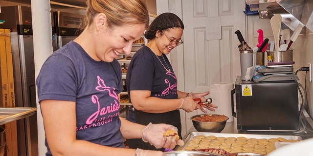 Janie Deegan, owner of Janie's Life-Changing Baked Goods in Manhattan, New York, making cookies with staff. 