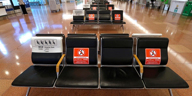 The arrival lobby of the international terminal  is deserted at Haneda Airport in Tokyo, Japan, Tuesday, Nov. 30, 2021. Japan confirmed on Tuesday its first case of the new omicron coronavirus variant, a visitor who recently arrived from Namibia, an official said. Japan announced Monday it will suspend entry of all foreign visitors from around the world as a new coronavirus variant spreads.