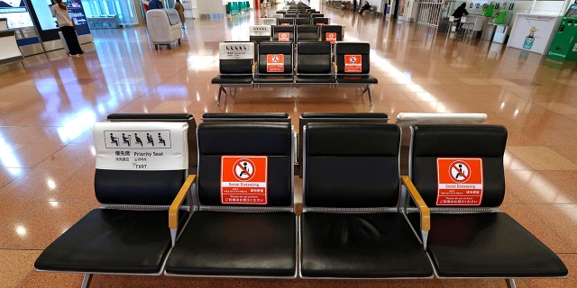 The arrival lobby of the international terminal is deserted at Haneda Airport in Tokyo, Japan, Tuesday, Nov. 30, 2021. Japan confirmed on Tuesday its first case of the new omicron coronavirus variant, a visitor who recently arrived from Namibia, an official said. Japan announced Monday it will suspend entry of all foreign visitors from around the world as a new coronavirus variant spreads.