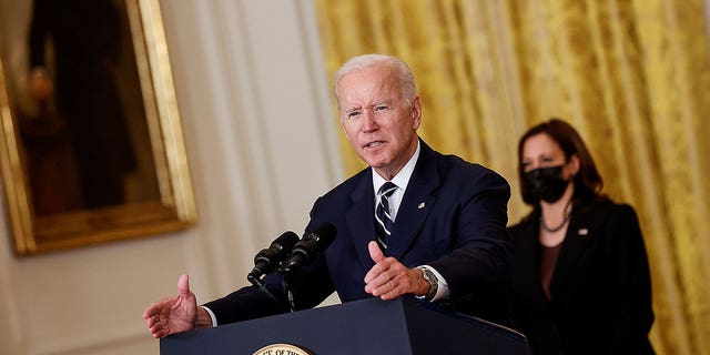 U.S. President Joe Biden delivers remarks about his Build Back Better agenda and the bipartisan infrastructure deal as Vice President Kamala Harris stands by in the East Room of the White House in Washington, U.S., October 28, 2021.
