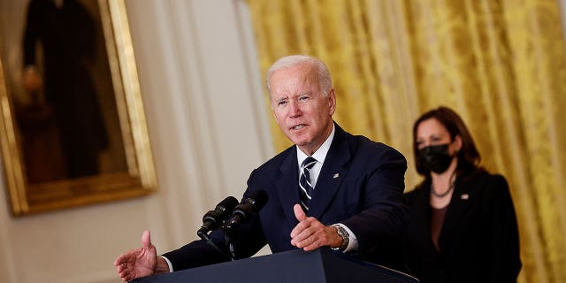 U.S. President Joe Biden delivers remarks about his Build Back Better agenda and the bipartisan infrastructure deal as Vice President Kamala Harris stands by in the East Room of the White House in Washington, U.S., October 28, 2021.