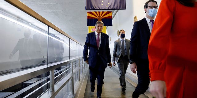 U.S. Senator Joe Manchin (D-WV) departs through the Senate subway after remarks to reporters at the U.S. Capitol in Washington, D.C., U.S. November 1, 2021. REUTERS/Jonathan Ernst