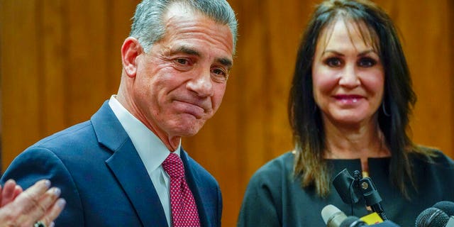 Republican gubernatorial candidate Jack Ciattarelli, left, is joined by his wife Melinda as he speaks during a news conference, Friday, Nov. 12, 2021, in Raritan, N.J. Ciattarelli conceded the race to Democratic Gov. Phil Murphy.