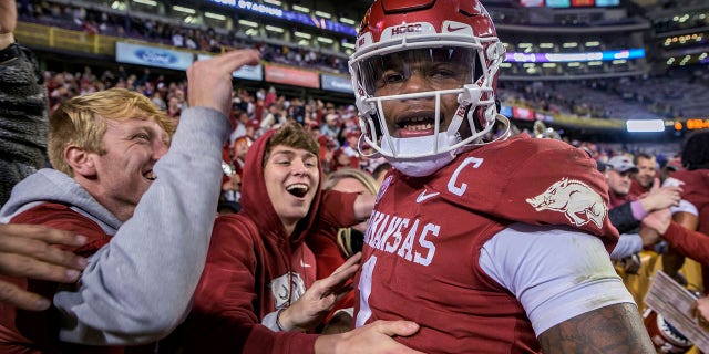 Arkansas defensive back Jalen Catalon (1) celebrates with fans after the tam's 16-13 overtime win against LSU in an NCAA college football game in Baton Rouge, La., Saturday, Nov. 13, 2021.