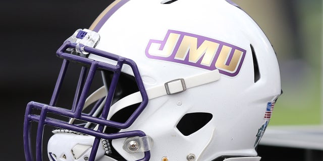 A James Madison Dukes helmet on the sidelines prior to a game between the Dukes and the Richmond Spiders on Oct. 16, 2021, at E. Claiborne Robins Stadium in Richmond, Virginia.