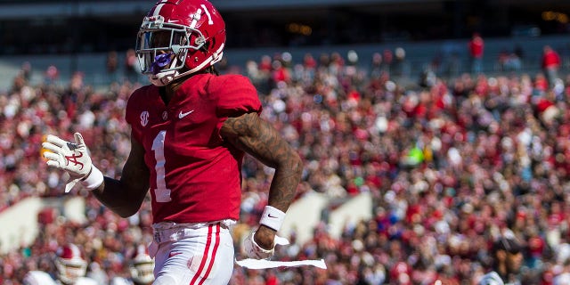Alabama wide receiver Jameson Williams (1) celebrates a touchdown reception during the first half of an NCAA college football game against New Mexico State, Saturday, Nov. 13, 2021, in Tuscaloosa, Ala.