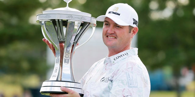 Tournament winner Jason Kokrak hold the trophy during presentation ceremonies after the final round of the Houston Open golf tournament Sunday, Nov. 14, 2021, in Houston.