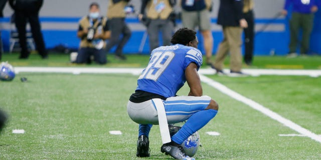Detroit Lions cornerback Jerry Jacobs squats on the field after the Chicago Bears kicked a winning field goal with time expiring to win the NFL football game, Thursday, Nov. 25, 2021, in Detroit.