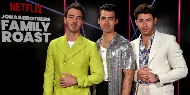 LOS ANGELES, CALIFORNI - NOVEMBER 23: In this image, released November 23, 2021, (LR) Kevin Jonas, Joe Jonas, and Nick Jonas attend the Jonas Brothers Family Roast Netflix Comedy Special Taping at CBS Television City in Los Angeles, California.  (Photo by Phillip Faraone/Getty Images for Netflix)