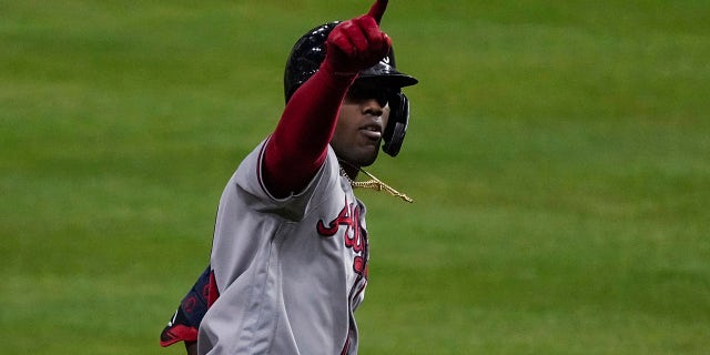Atlanta Braves' Jorge Soler celebrates a three-run home run during the third inning in Game 6 of baseball's World Series between the Houston Astros and the Atlanta Braves Tuesday, Nov. 2, 2021, in Houston.