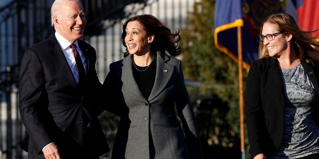 U.S. President Joe Biden, Vice President Kamala Harris and Iron Workers Local 86 Political Director Heather Kurtenbach arrive for Biden to sign the Infrastructure Investment and Jobs Act on the South Lawn at the White House in Washington, U.S. November 15, 2021.