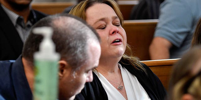 Kyle Rittenhouse's mother Wendy Rittenhouse reacts to the verdict during her son's trial at the Kenosha County Courthouse in Kenosha, Wisconsin, U.S., November 19, 2021.