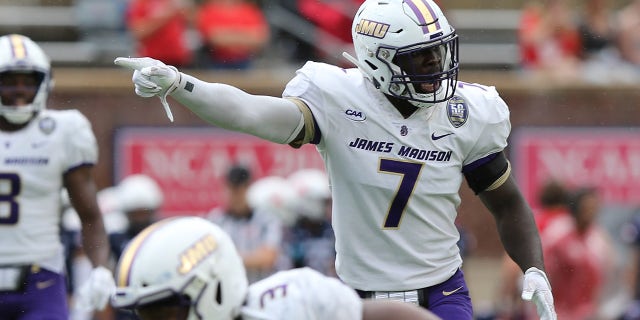 James Madison Dukes linebacker Kelvin Azanama (7) points into the backfield during a game between James Madison and the Richmond Spiders on Oct, 16, 2021, at E. Claiborne Robins Stadium in Richmond, Virginia.