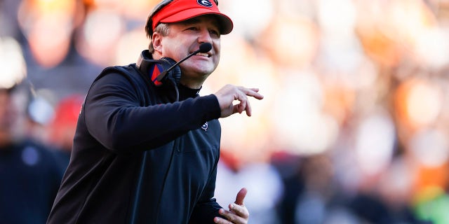 Georgia head coach Kirby Smart yells to his players during the first half of an NCAA college football game against Tennessee, Saturday, Nov. 13, 2021, in Knoxville, Tenn.