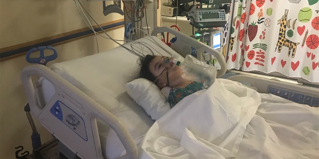 Kyla Luzader in a hospital bed Feb. 9, 2020.