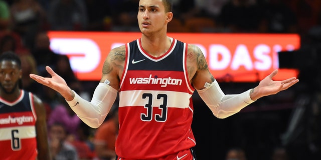 MIAMI, FLORIDA - NOVEMBER 18: Kyle Kuzma #33 of the Washington Wizards reacts towards an official during the second half against the Miami Heat at FTX Arena on November 18, 2021 in Miami, Florida.