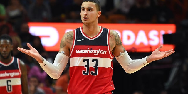 MIAMI, FLORIDA - NOVEMBER 18: Kyle Kuzma #33 of the Washington Wizards reacts towards an official during the second half against the Miami Heat at FTX Arena on November 18, 2021 in Miami, Florida.