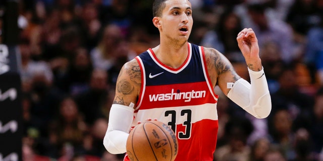 Nov 18, 2021; Miami, Florida, USA; Washington Wizards forward Kyle Kuzma (33) dribbles the basketball against the Miami Heat during the fourth quarter of the game at FTX Arena.