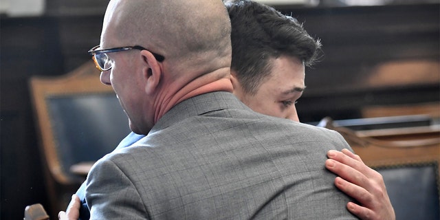 Kyle Rittenhouse hugs one of his attorneys, Corey Chirafisi, after he is found not guilt on all counts at the Kenosha County Courthouse in Kenosha, Wis., on Friday, Nov. 19, 2021.  The jury came back with its verdict afer close to 3 1/2 days of deliberation.  (Sean Krajacic/The Kenosha News via AP, Pool)