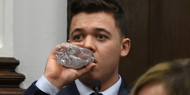 KENOSHA, WISCONSIN - NOVEMBER 10: Kyle Rittenhouse takes a drink of water while testifying during his trial at the Kenosha County Courthouse on November 10, 2021 in Kenosha, Wisconsin.  (Photo by Mark Hertzberg-Pool/Getty Images)