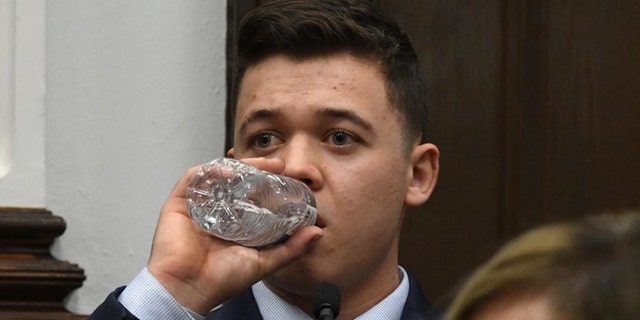 KENOSHA, WISCONSIN - NOVEMBER 10: Kyle Rittenhouse takes a drink of water while testifying during his trial at the Kenosha County Courthouse on November 10, 2021 in Kenosha, Wisconsin. (Photo by Mark Hertzberg-Pool/Getty Images)