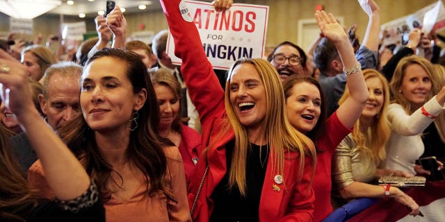 Hispanic supporters of Republican nominee for Governor of Virginia, Glenn Youngkin, react as Fox News declares Youngkin has won his race against Democratic Governor Terry McAuliffe and Youngkin will be the next Governor of Virginia during an election night party at a hotel in Chantilly, Virginia, U.S., November 3, 2021.