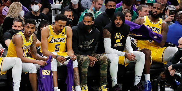 The Los Angeles Lakers bench looks on during the second half of an NBA basketball game against the Boston Celtics, Friday, Nov. 19, 2021, in Boston.