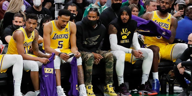 The Los Angeles Lakers bench looks on during the second half of an NBA basketball game against the Boston Celtics, Friday, Nov. 19, 2021, in Boston.
