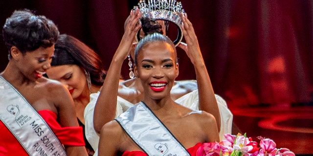 Lalela Mswane is crowned Miss South Africa in Cape Town, Saturday, Oct. 16, 2021. Controversy is swirling around the Miss South Africa beauty pageant, as the government has withdrawn its support from the event because of its affiliation with the Miss Universe contest, which is to be held in Israel in December.