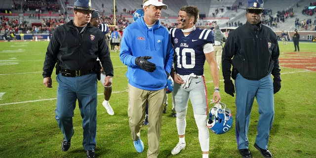 Nov 20, 2021; Oxford, Mississippi, USA; Mississippi Rebels head coach Lane Kiffin reacts with wide receiver John Rhys Plumlee (10) during after the game against the Vanderbilt Commodores at Vaught-Hemingway Stadium.